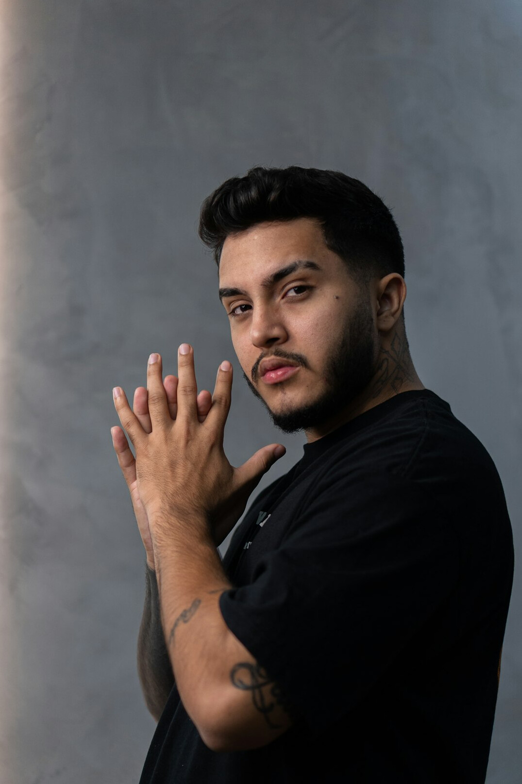 Studio portrait of a professional Latino man photographer