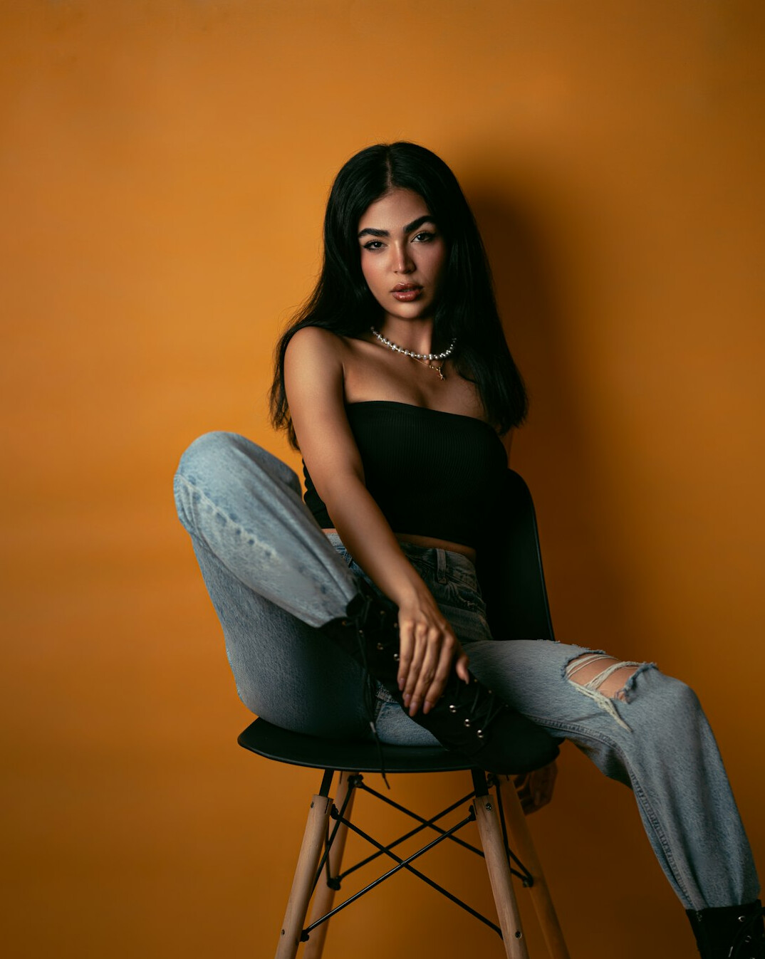 Studio portrait of a stylish young Latina woman influencer