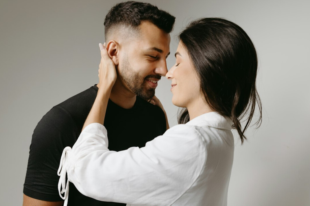 couple whispering secrets