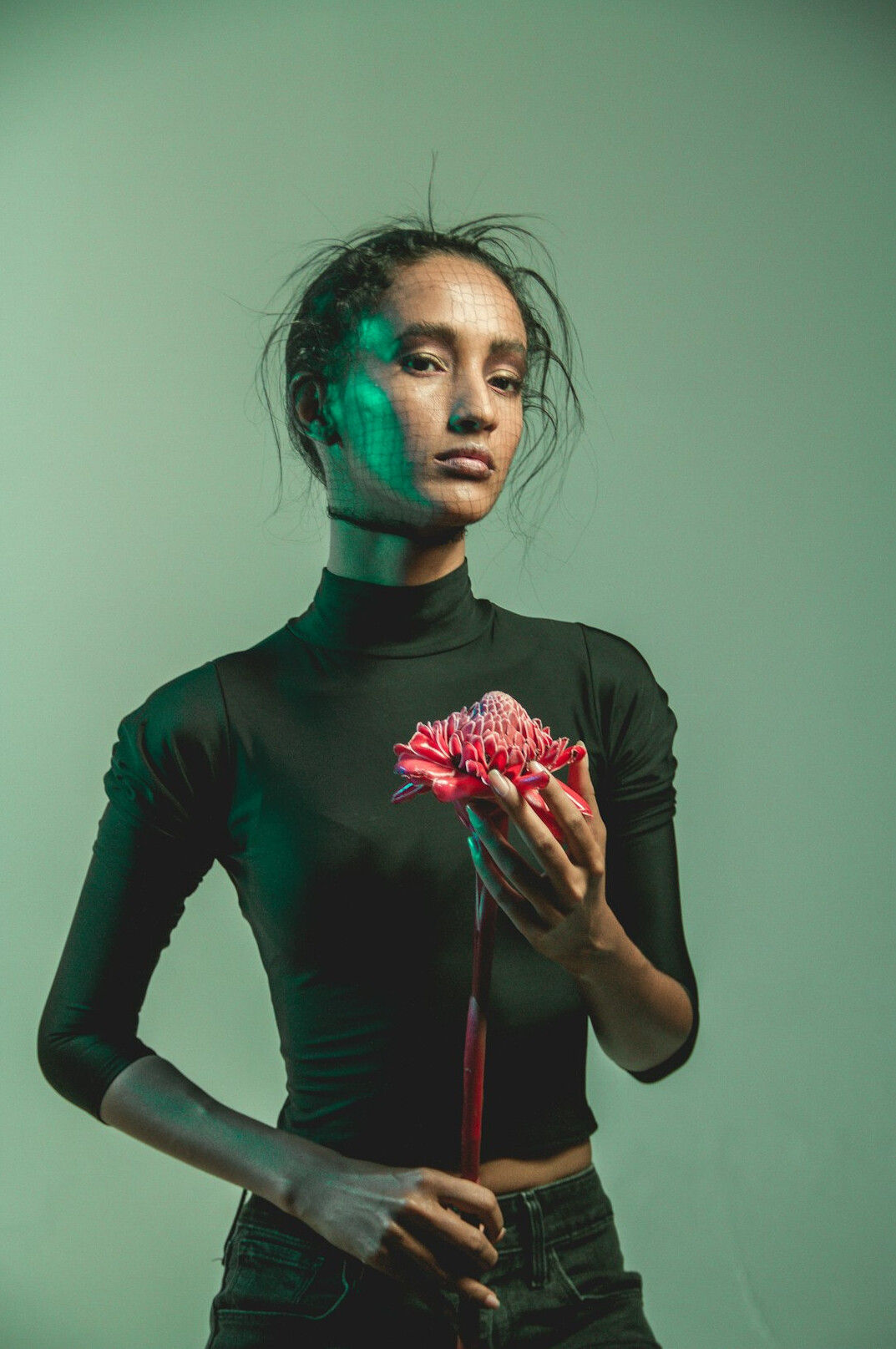 Studio portrait of a glamorous young Latina woman in elegant attire